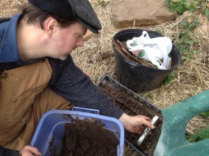 Volunteer making soil blocks.